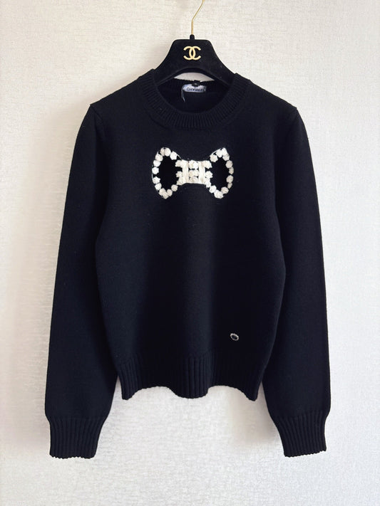 Openwork bow sweater