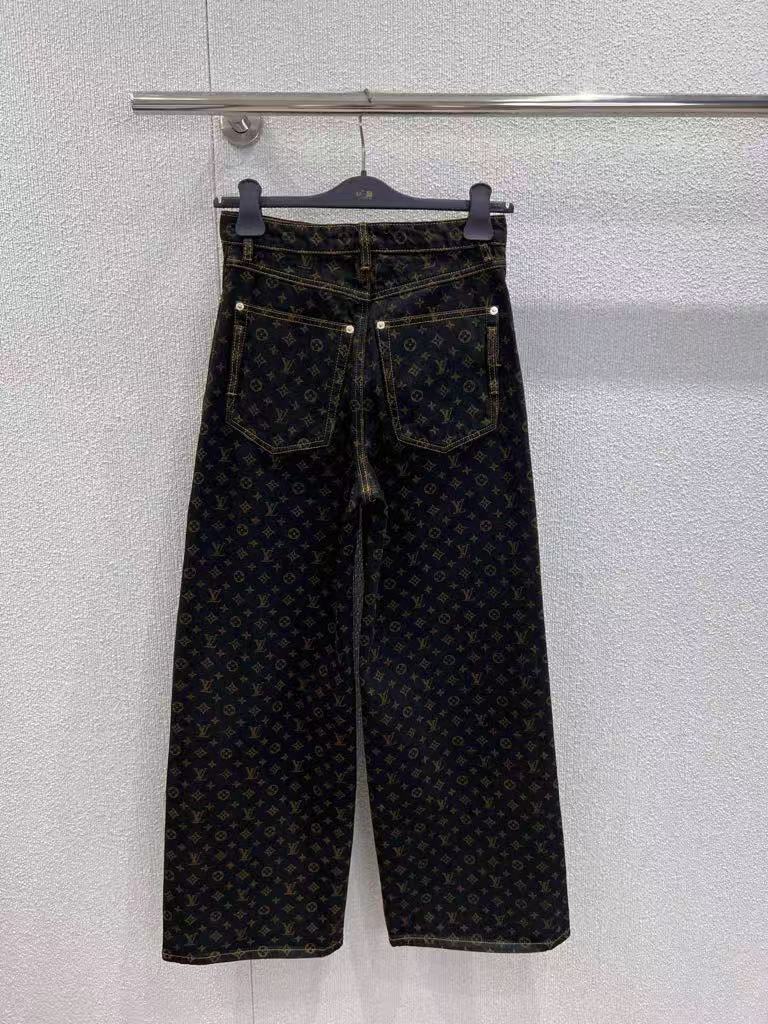 Vintage-printed wide-leg denim trousers.