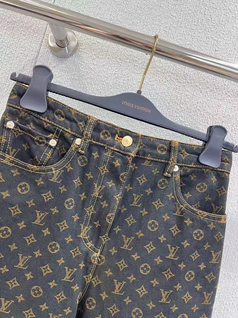 Vintage-printed wide-leg denim trousers.