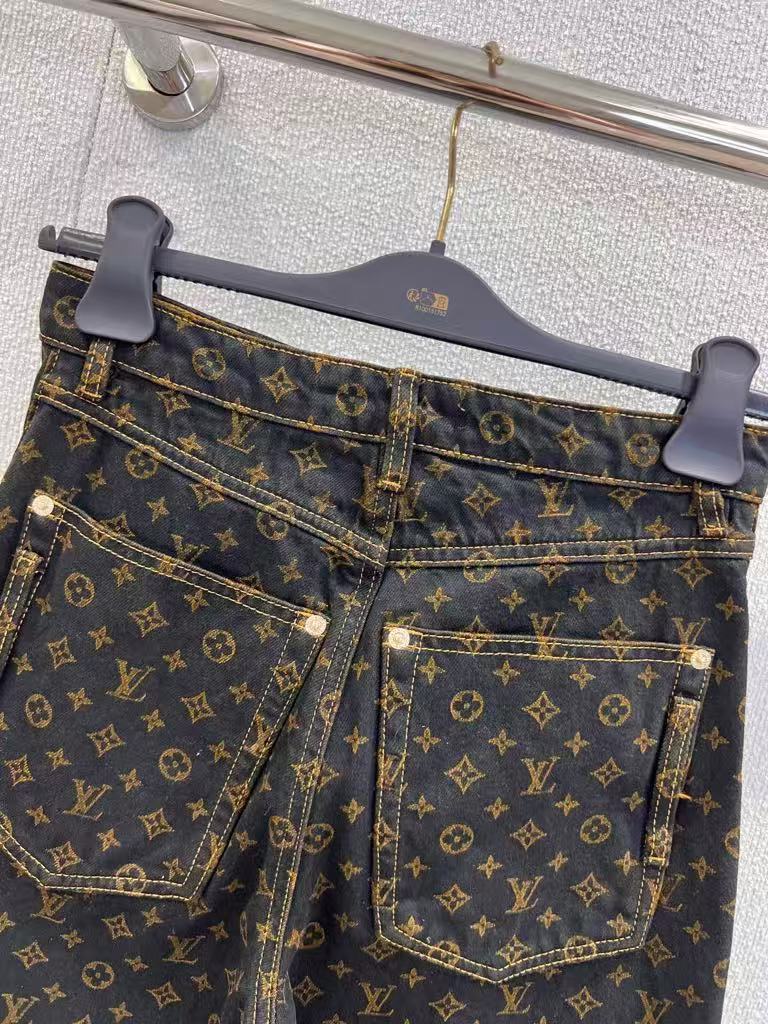 Vintage-printed wide-leg denim trousers.