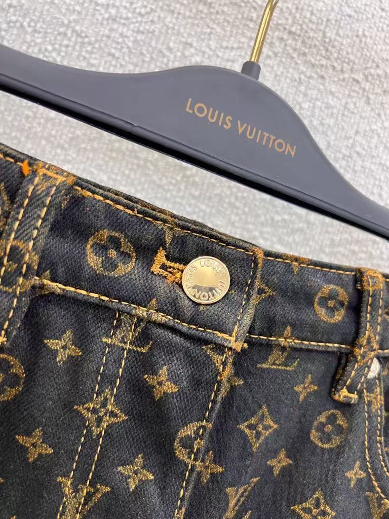 Vintage-printed wide-leg denim trousers.