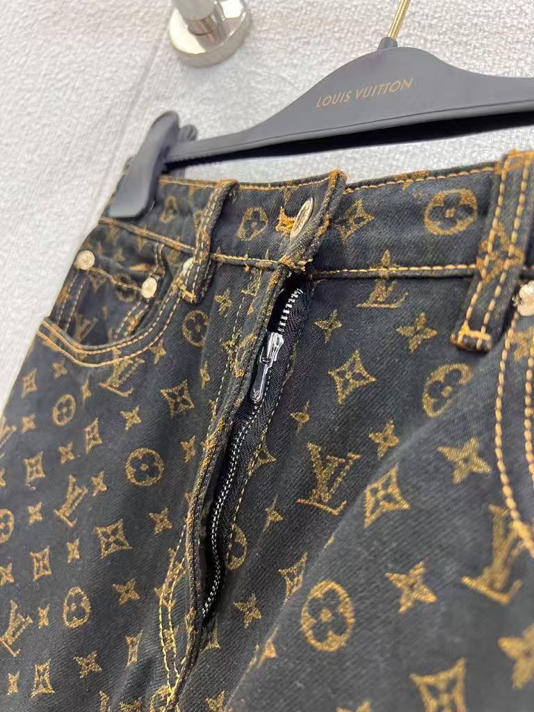 Vintage-printed wide-leg denim trousers.