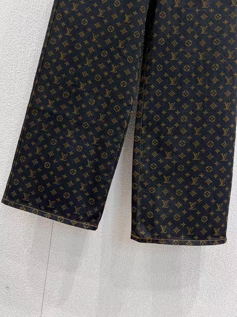 Vintage-printed wide-leg denim trousers.