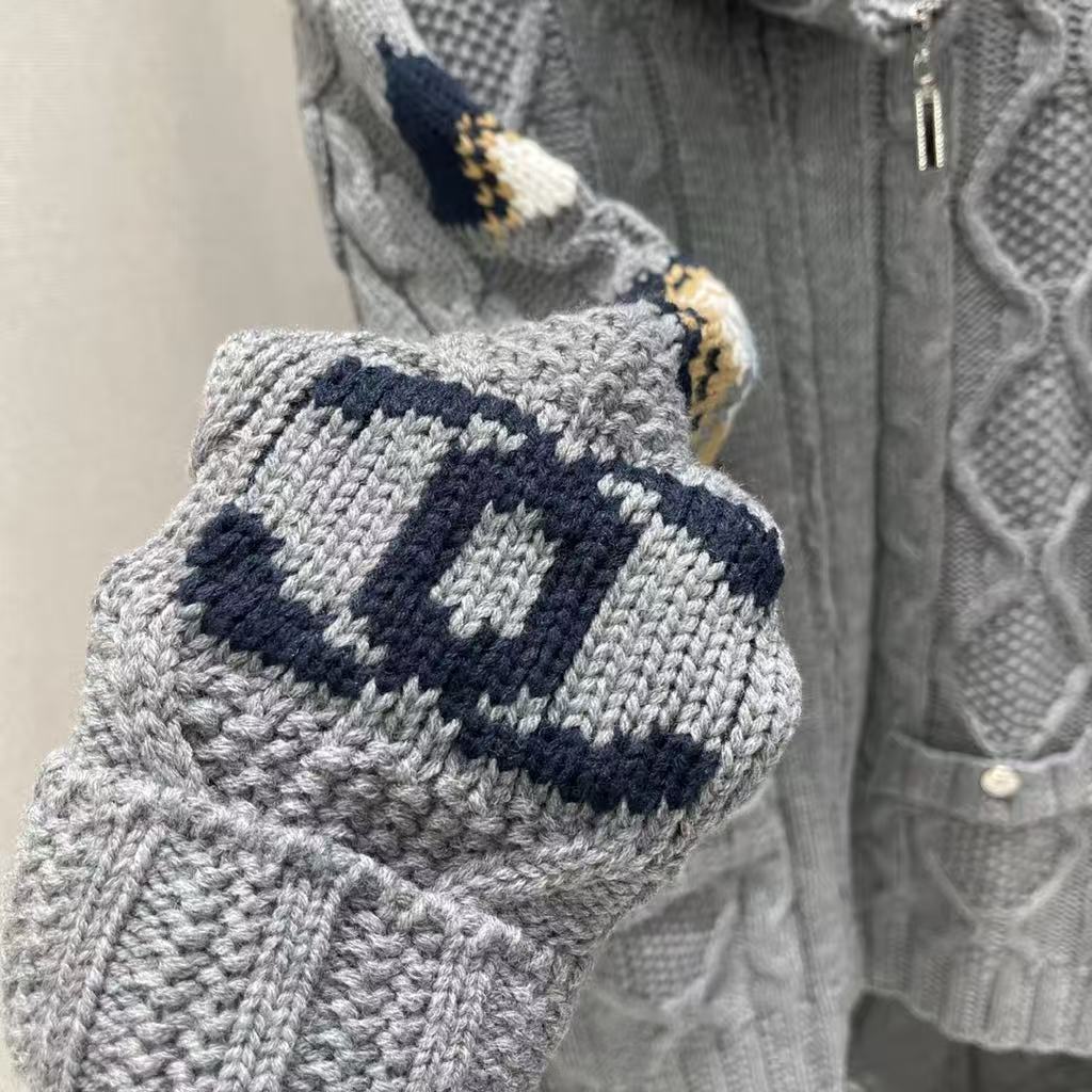 New for Early Fall 2025, this knitted jacquard zipper sweater