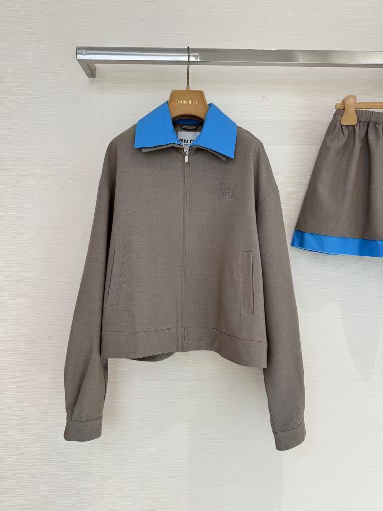 New for early fall, this lapel-embroidered, color-blocked jacket and skirt pair.