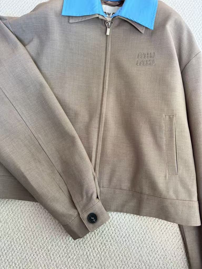 New for early fall, this lapel-embroidered, color-blocked jacket and skirt pair.