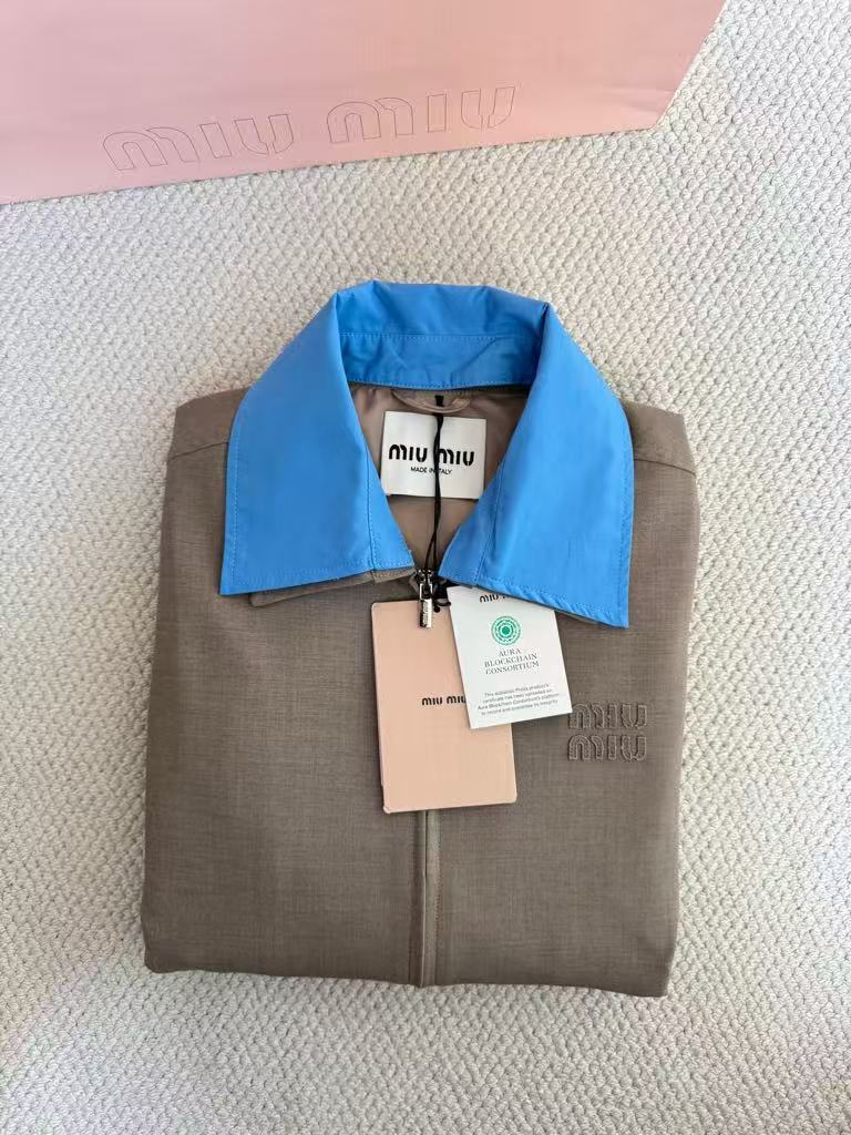 New for early fall, this lapel-embroidered, color-blocked jacket and skirt pair.