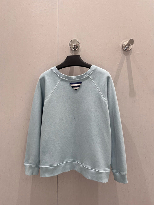 Light blue sweatshirt with distressed design