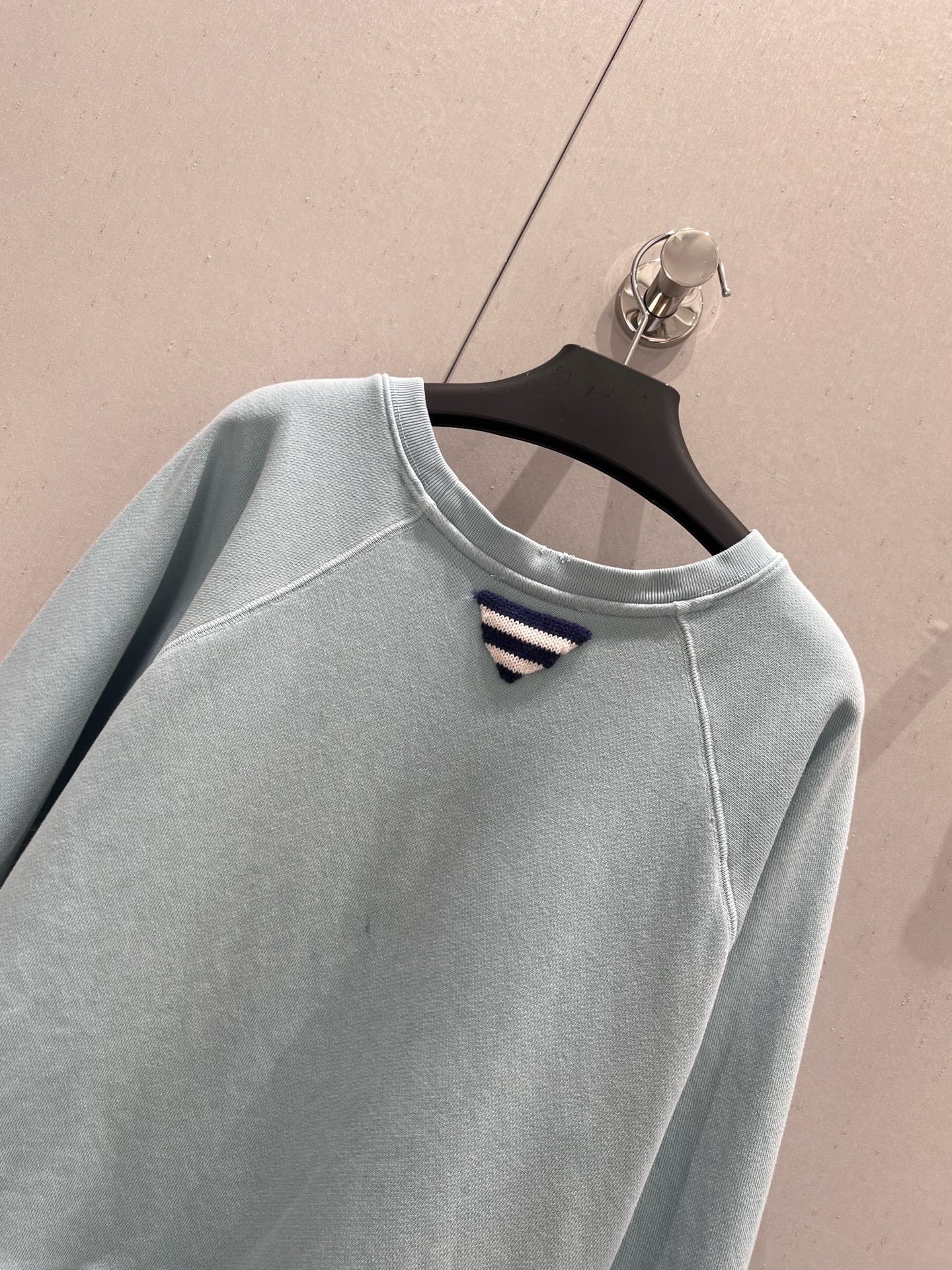Light blue sweatshirt with distressed design