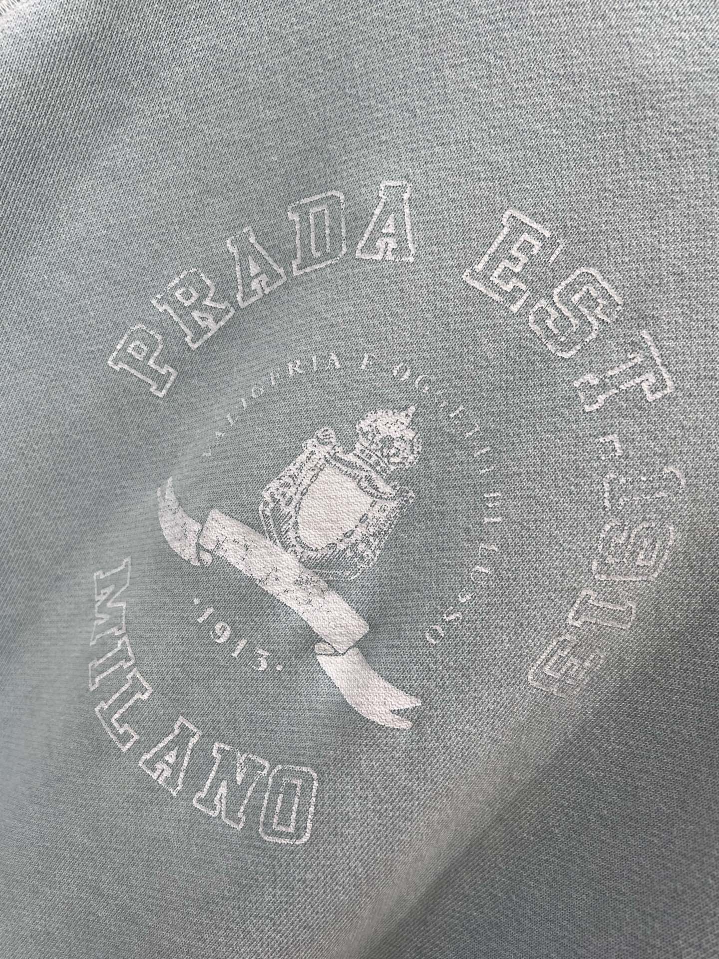 Light blue sweatshirt with distressed design