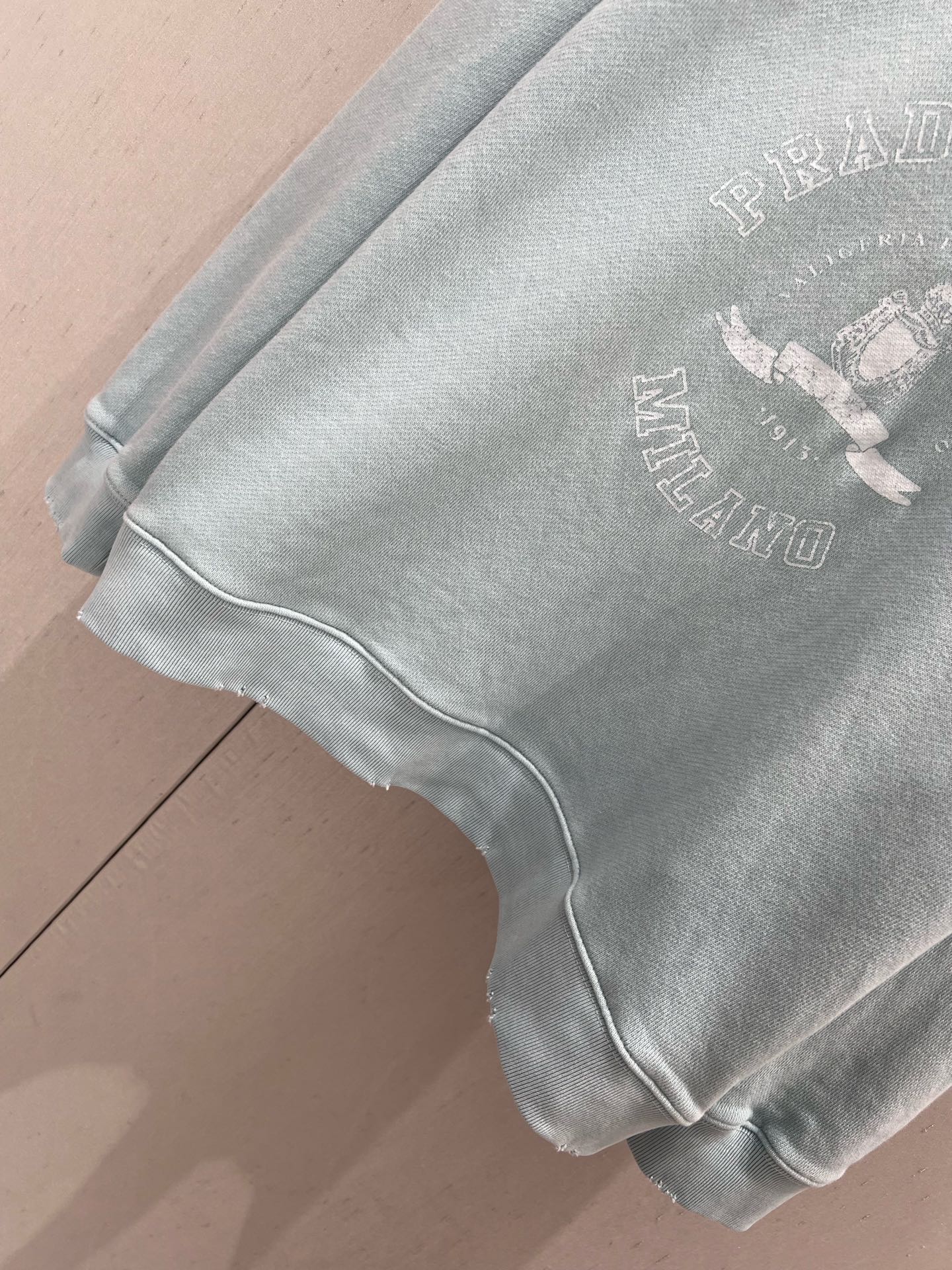 Light blue sweatshirt with distressed design