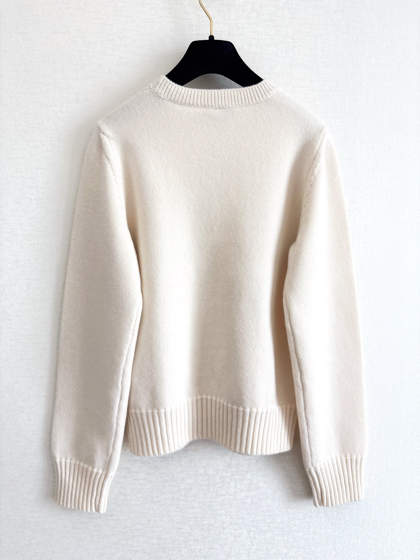 Openwork bow sweater