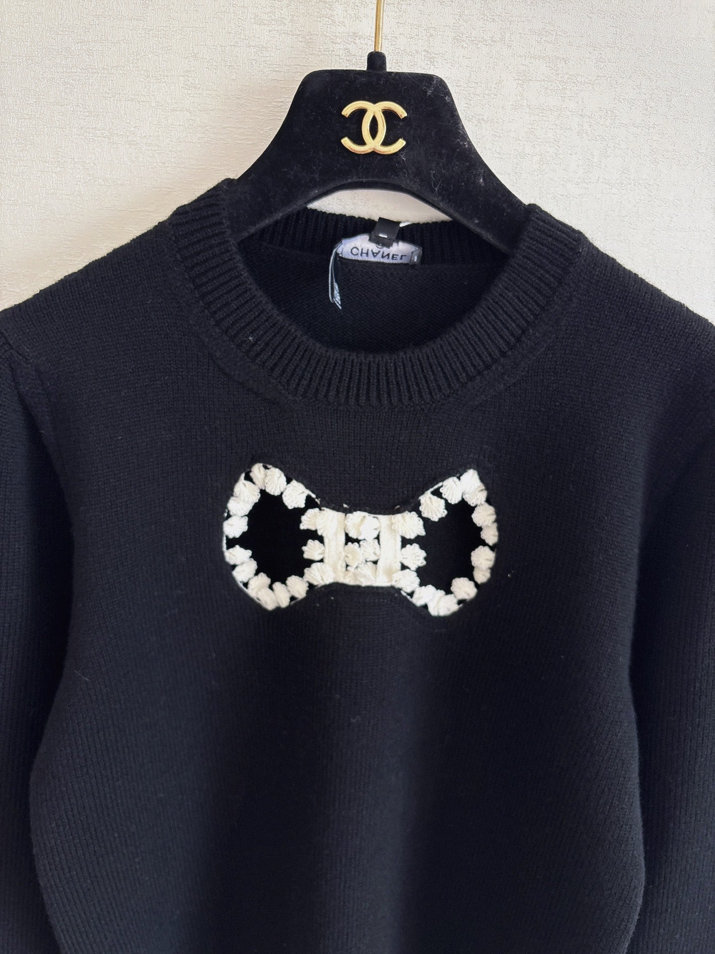 Openwork bow sweater