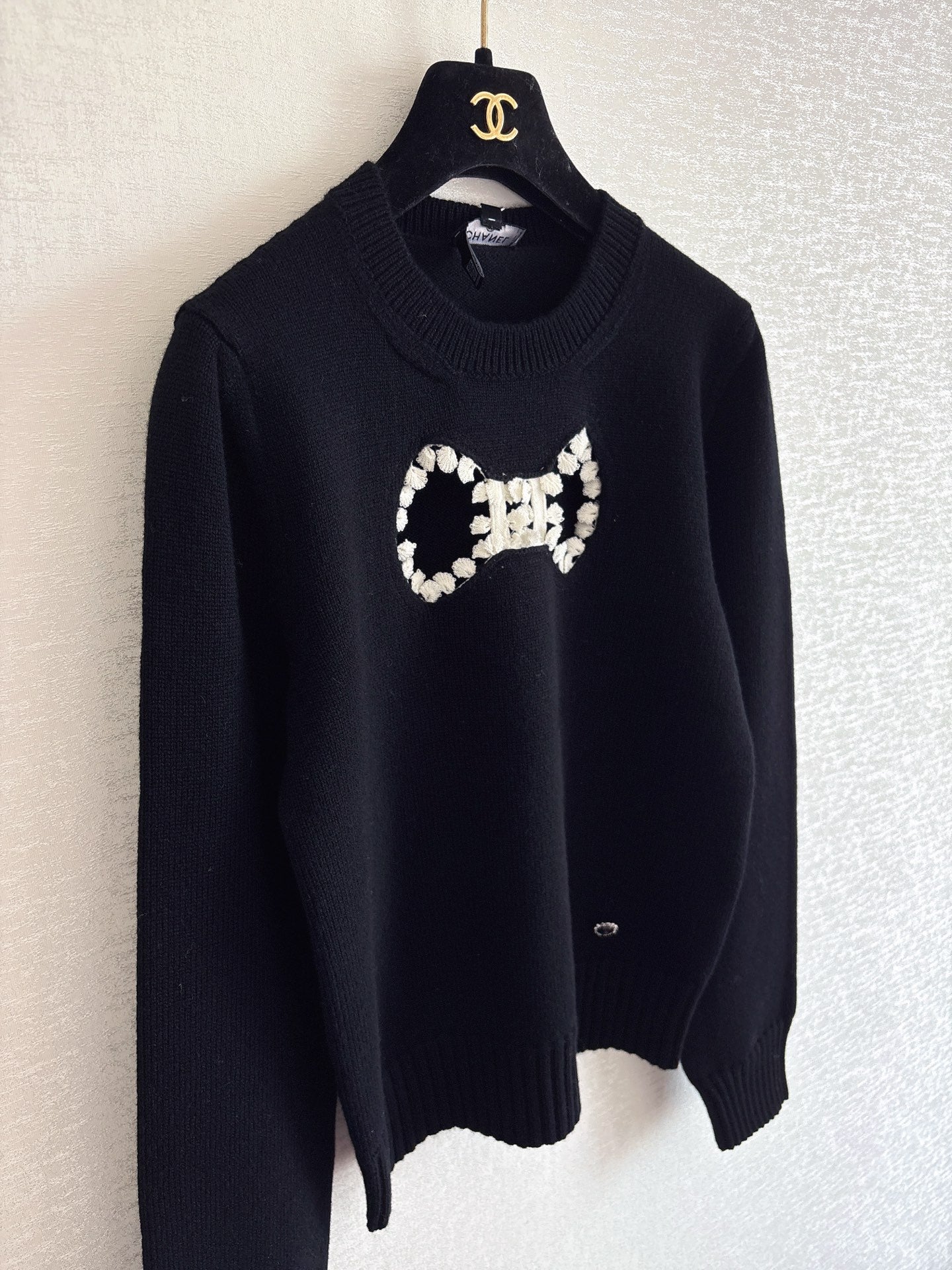 Openwork bow sweater