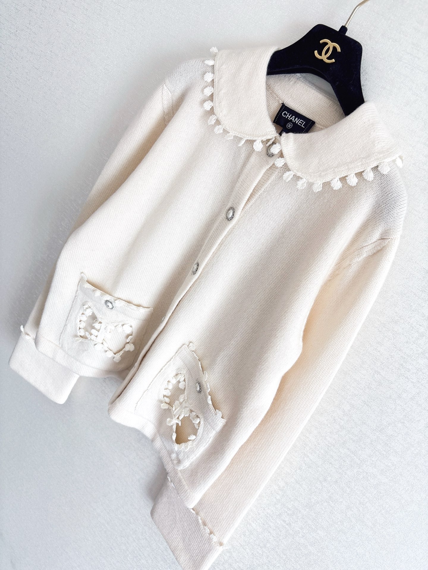 Bow-tie openwork pocket Peter Pan collar cardigan